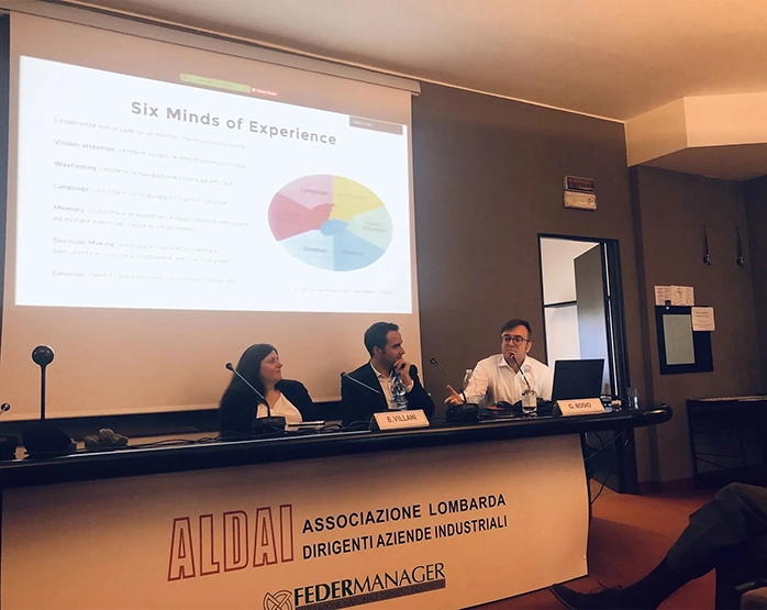 Conferenza presso ALDAI su innovazione centrata sull’essere umano, con tre relatori seduti a un tavolo